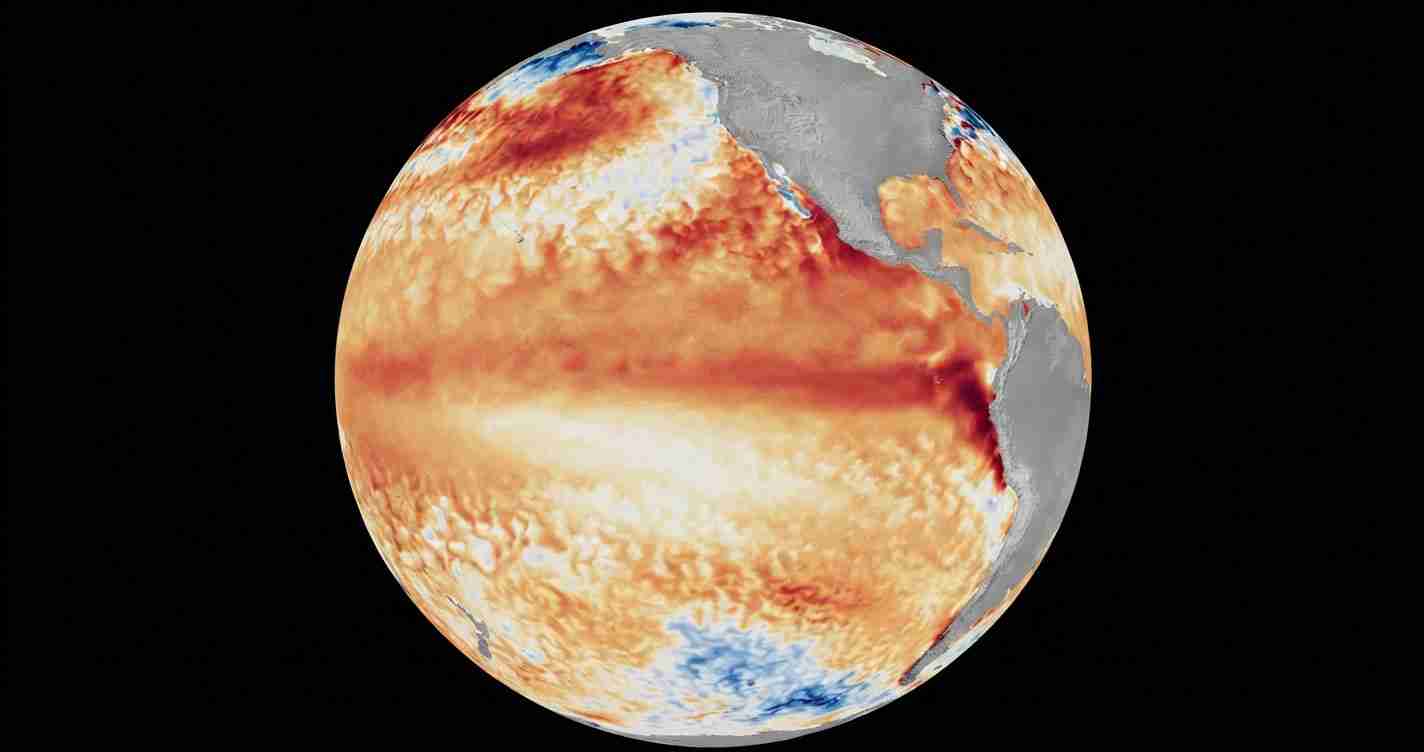 Global map of sea surface temperature anomalies shown in red and orange over a black space backdrop, Earth centered in view and the Americas visible on the right side.