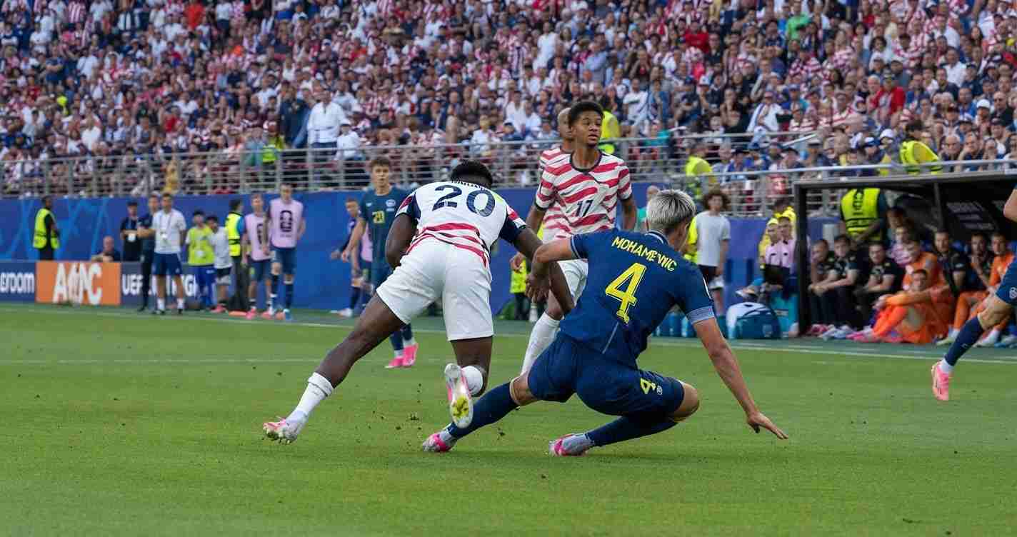 Soccer match moment: a blue-team defender slides in to challenge a white-and-red attacker in a packed stadium.